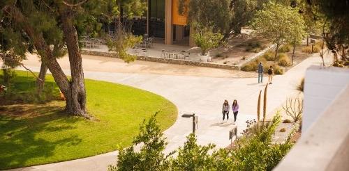 three students walk towards mcconnell dining hall